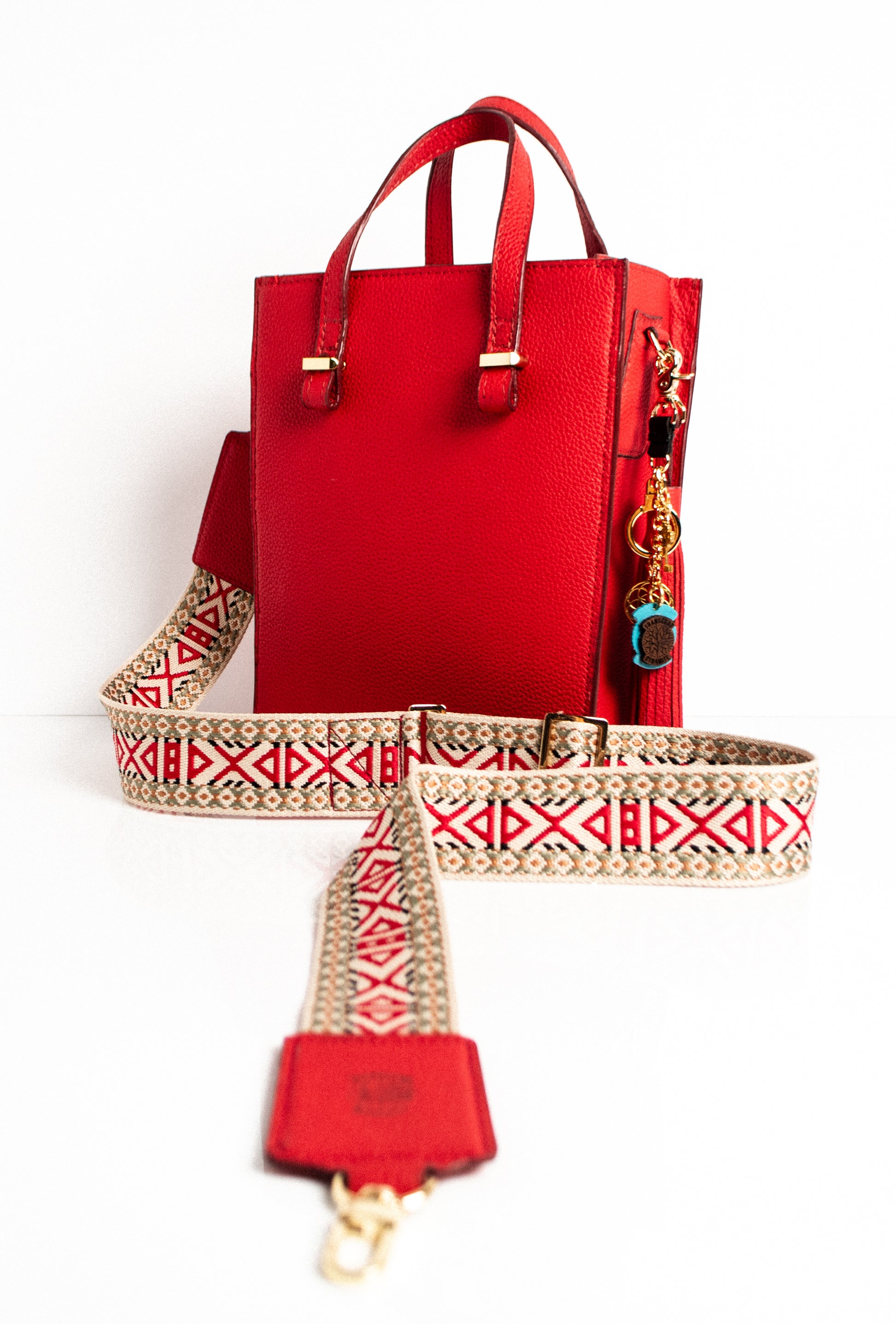 red and beige embroidered handbag strap with leather ends