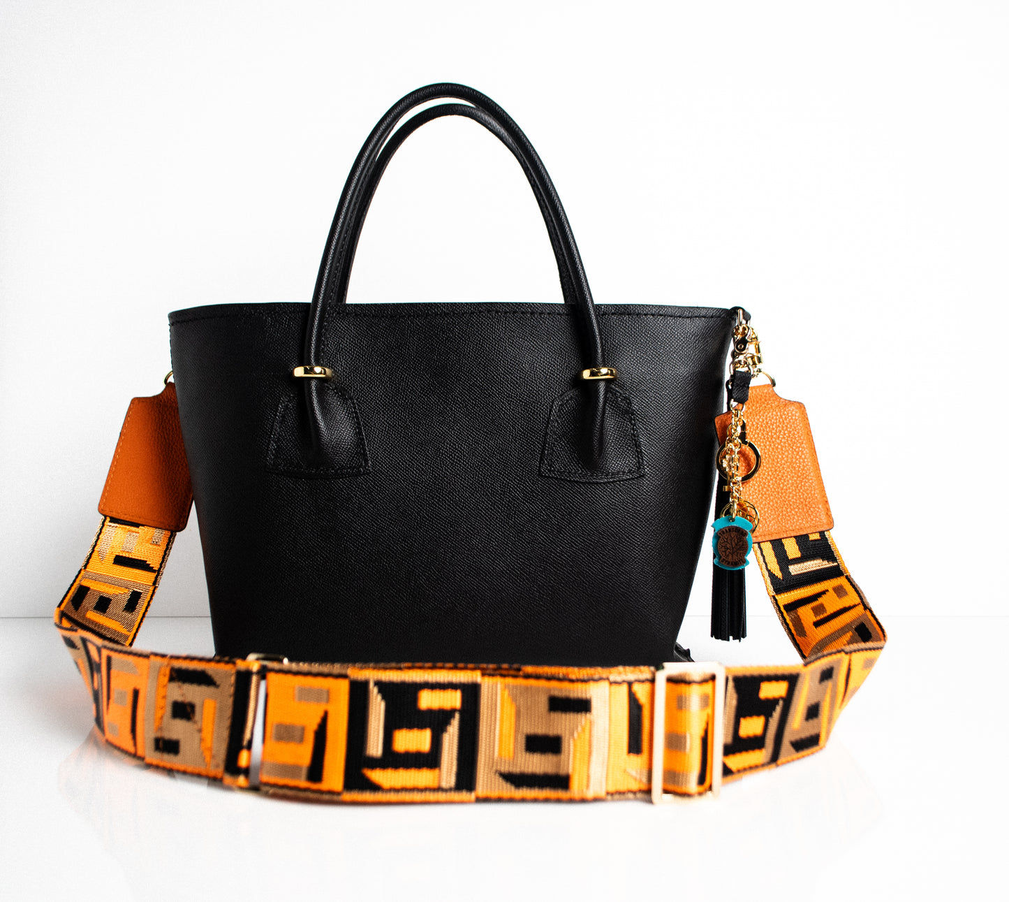 orange and black geometric patterned bag strap