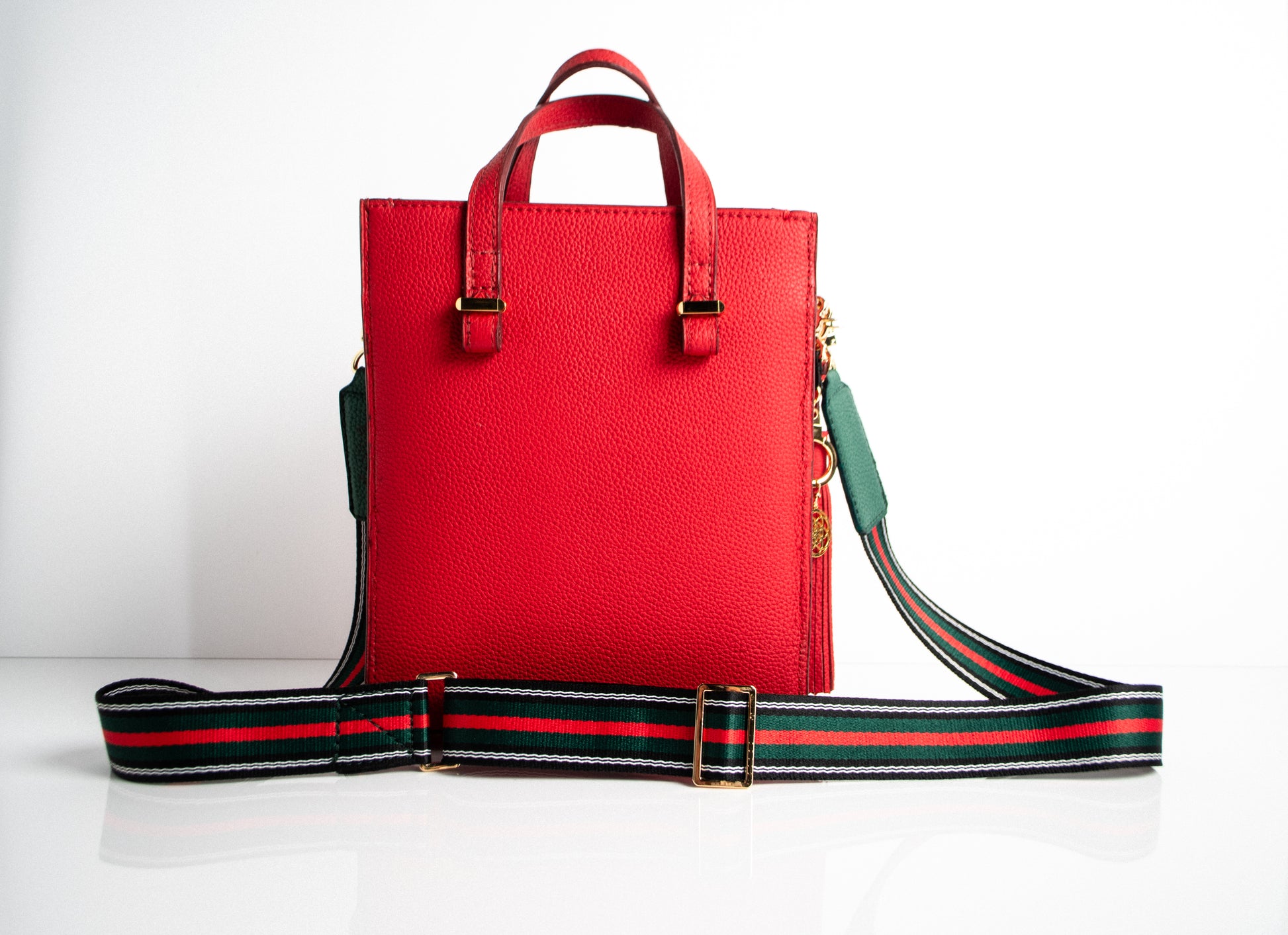 red and green striped handbag strap for a black leather purse